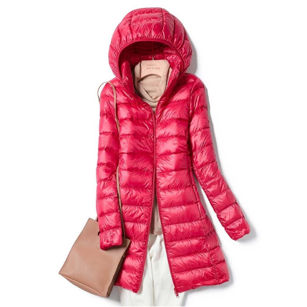 Warm women's puffer jacket, ultralight design. Perfect winter outerwear for cold weather and travel.