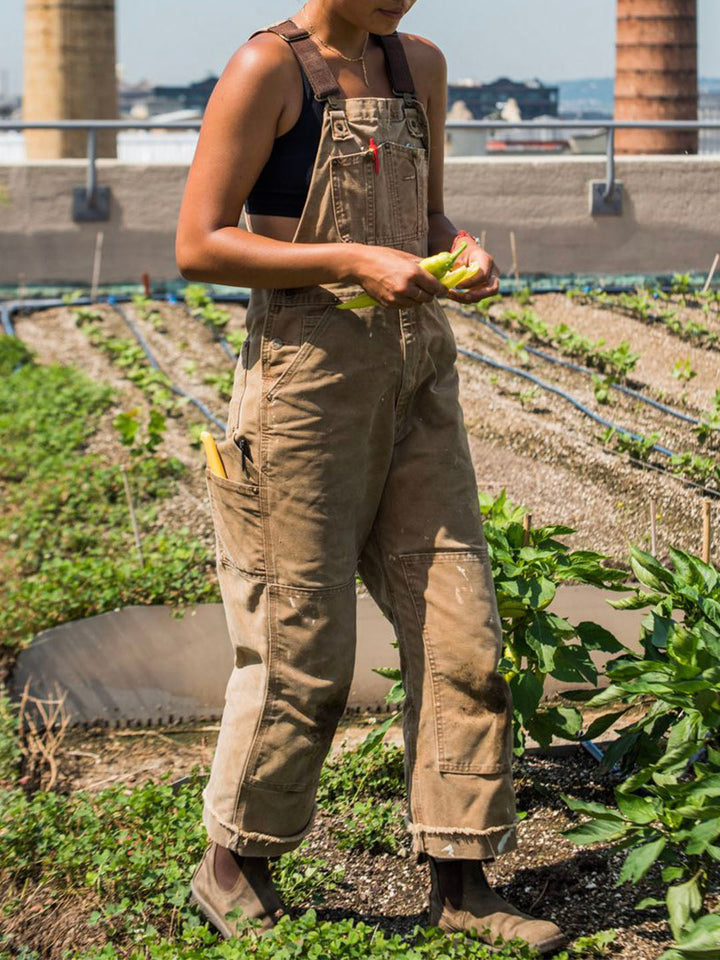 Women's utility dungaree jumpsuit in a relaxed fit. Casual workwear style, perfect for everyday outfits.