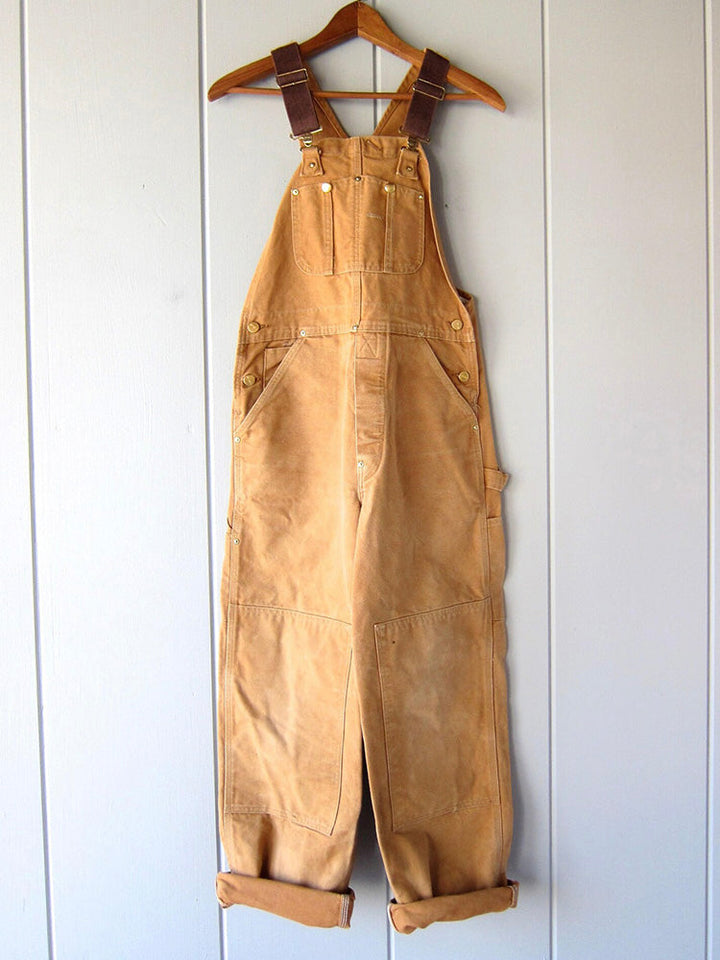 Versatile women's utility dungaree jumpsuit, showcasing a comfortable relaxed fit and workwear-inspired style.