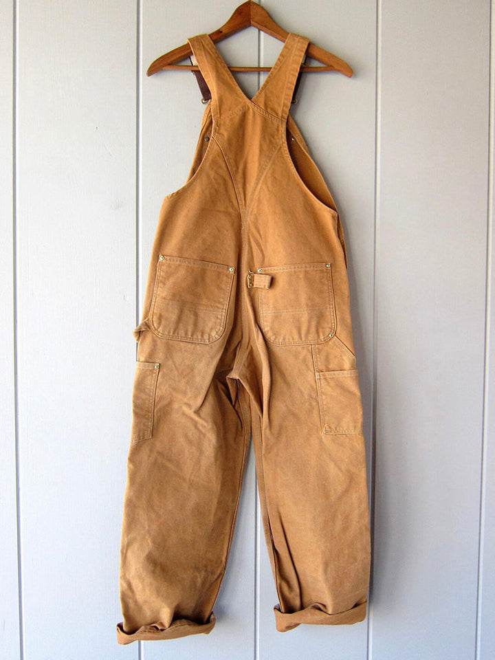 Stylish women's utility jumpsuit. Comfortable, durable fabric for a casual workwear-inspired everyday outfit.