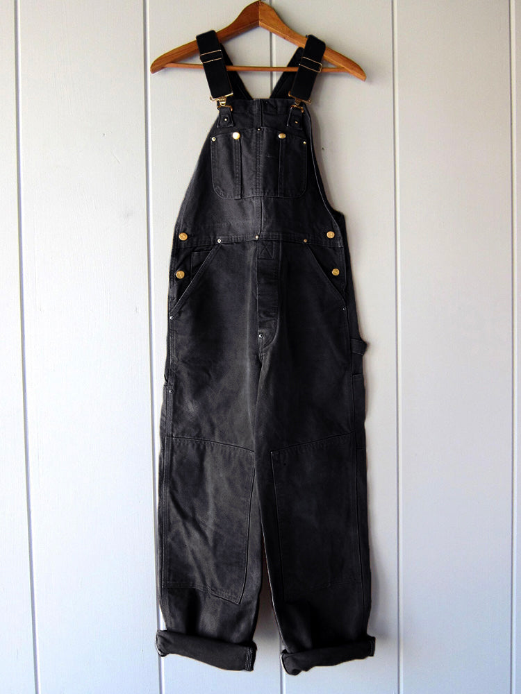 Women's relaxed fit utility dungaree jumpsuit. Casual workwear style with adjustable straps for all-day comfort.
