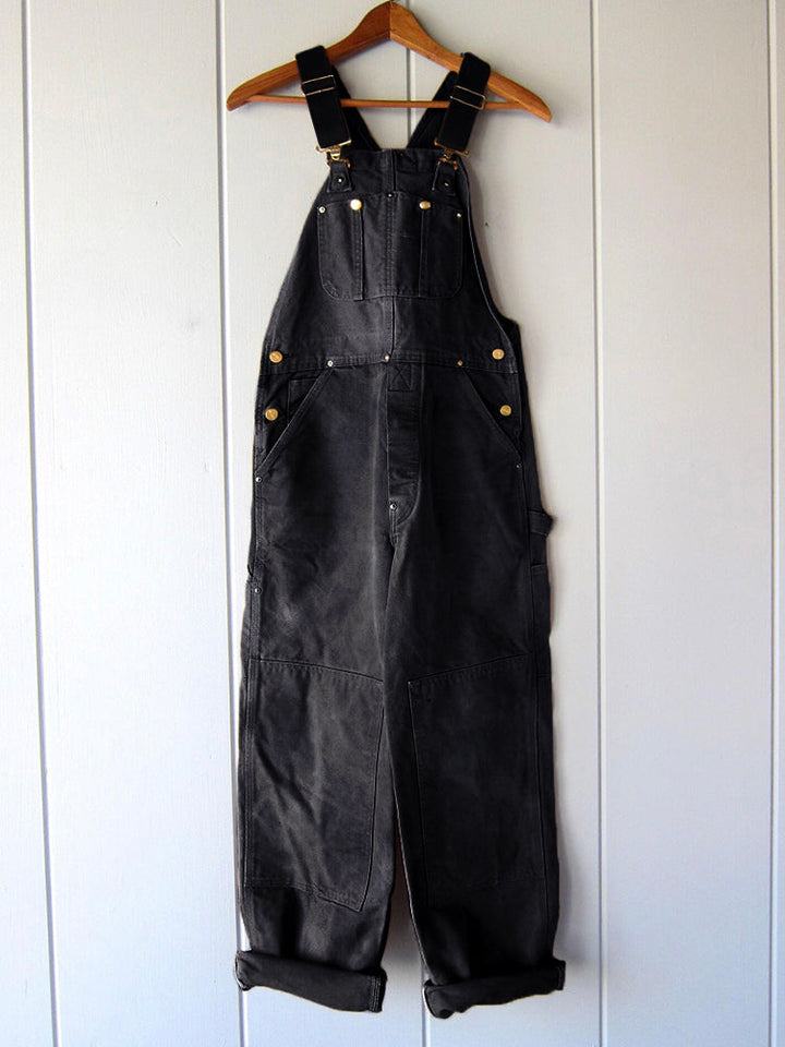 Women's relaxed fit utility dungaree jumpsuit. Casual workwear style with adjustable straps for all-day comfort.