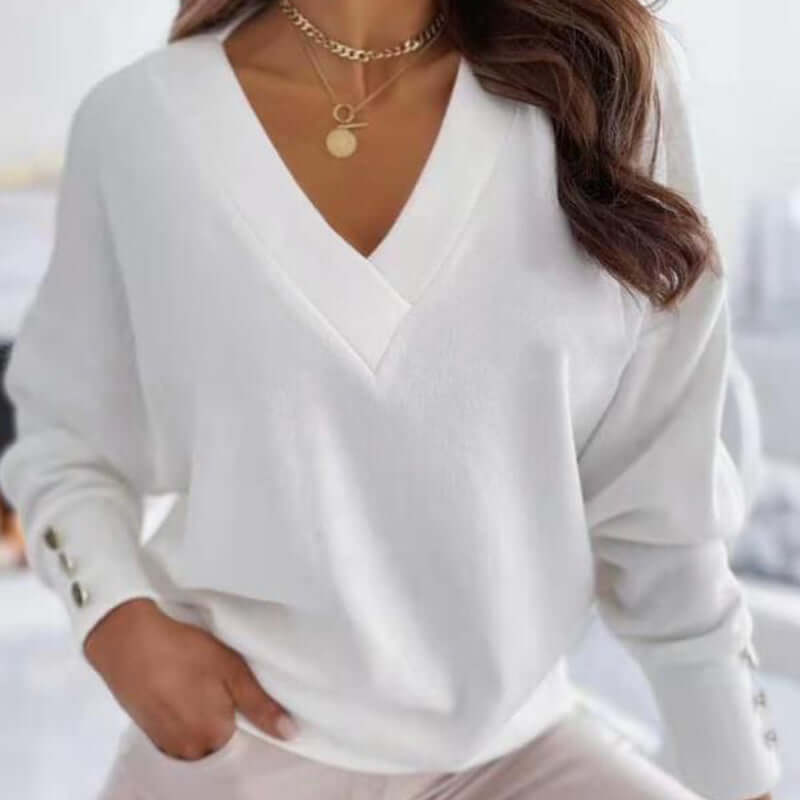 Essential women's V-neck cotton sweater, perfect for casual winter layering and comfort.