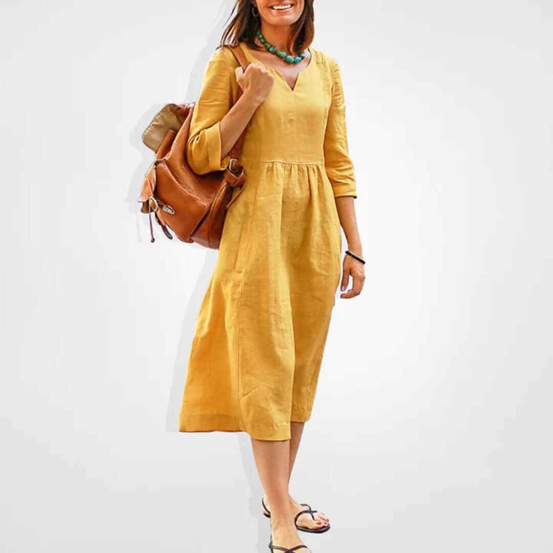 Comfortable three-quarter sleeve V-neck empire waist midi dress for women, ideal for casual spring and summer wear.