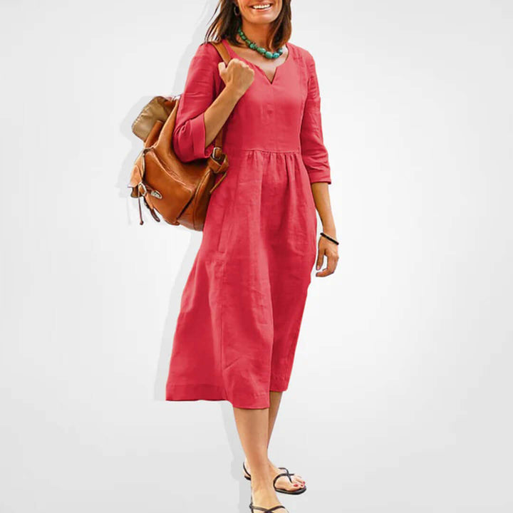 Elegant rayon blend V-neck empire waist midi dress. Versatile women's fashion for spring, summer, and casual outings.