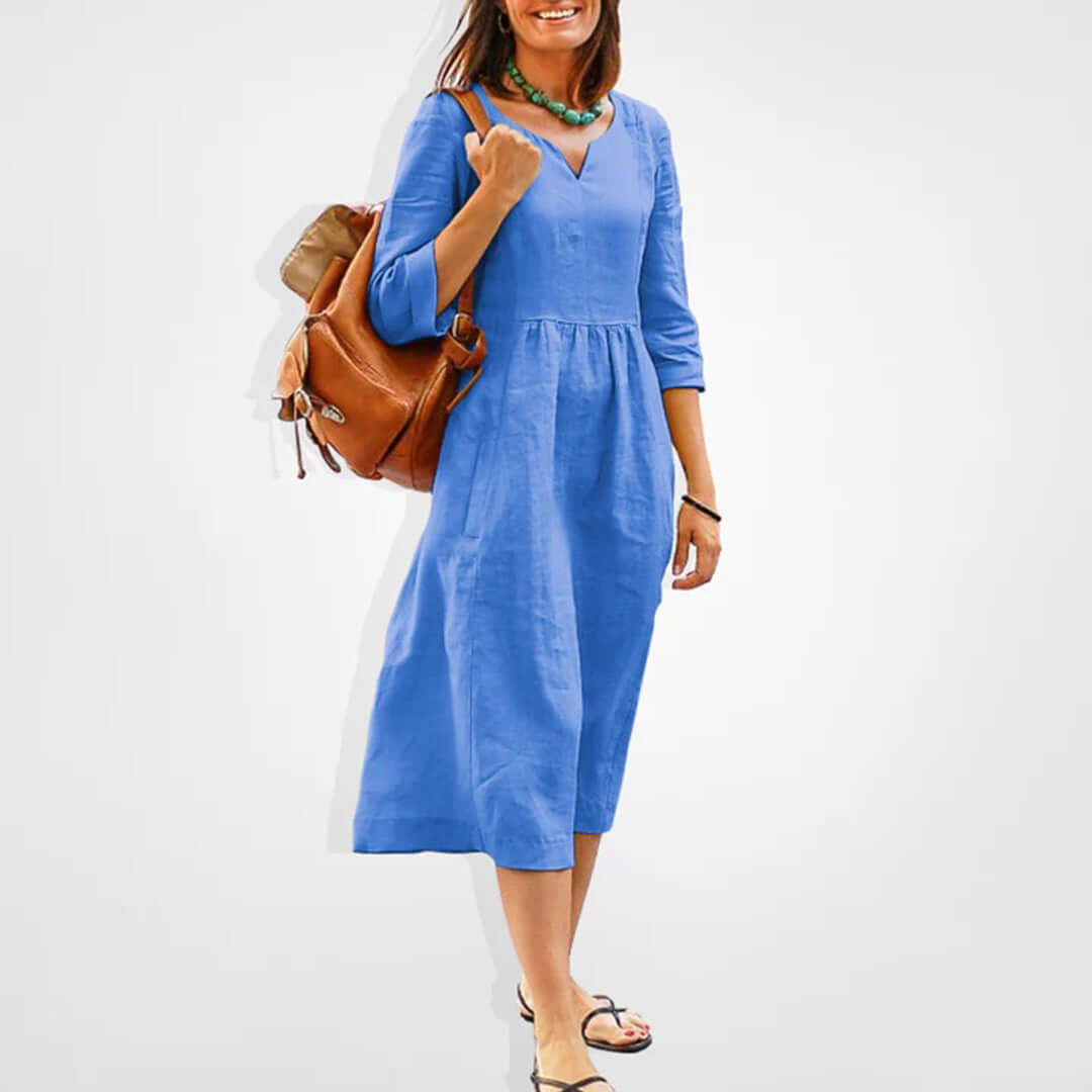 Chic women's V-neck midi dress with empire waist and three-quarter sleeves, a comfortable and stylish spring/summer essential.