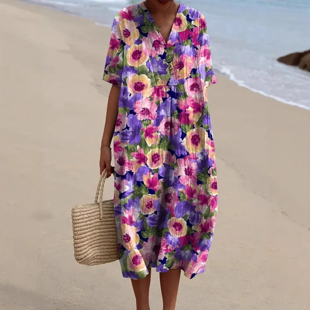 Women's V-Neck Floral Midi Dress, perfect for beach, summer, or vacation. Flowy and vibrant.