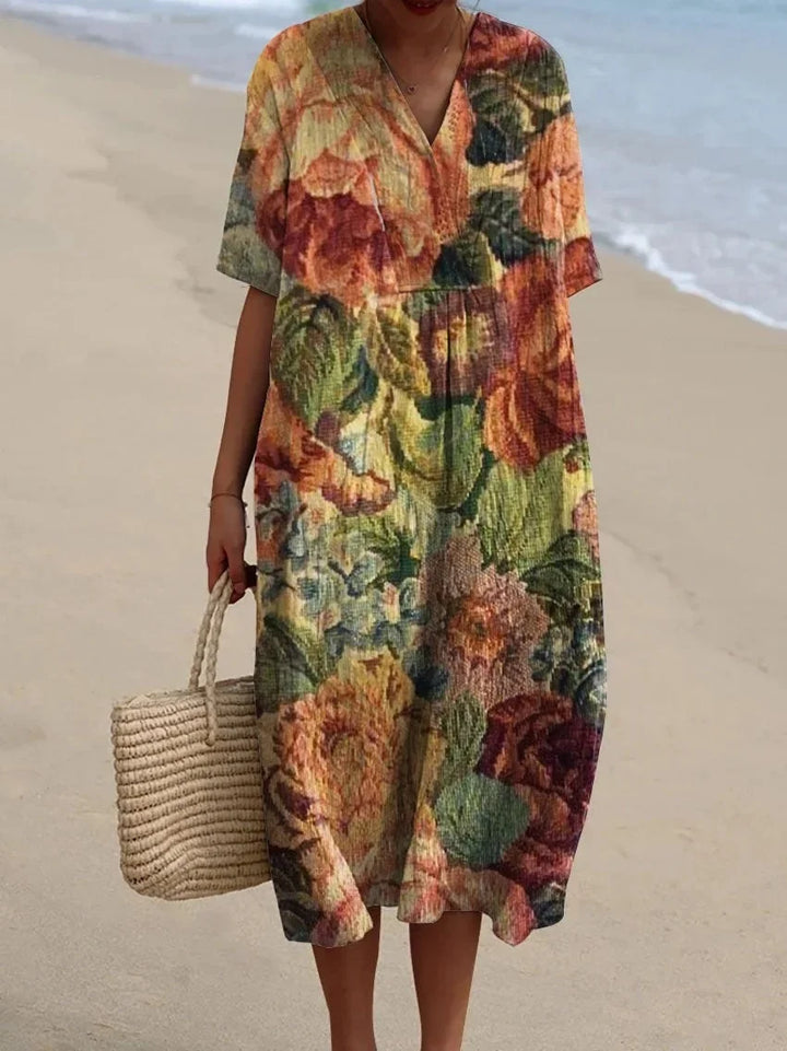 Vibrant floral print midi dress for women, featuring a flattering V-neck. Ideal summer and beach vacation fashion.