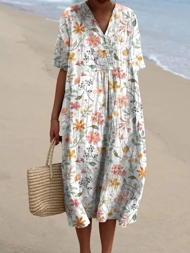 Chic V-neck midi dress for women with beautiful floral patterns, suitable for summer beach outings and vacation.
