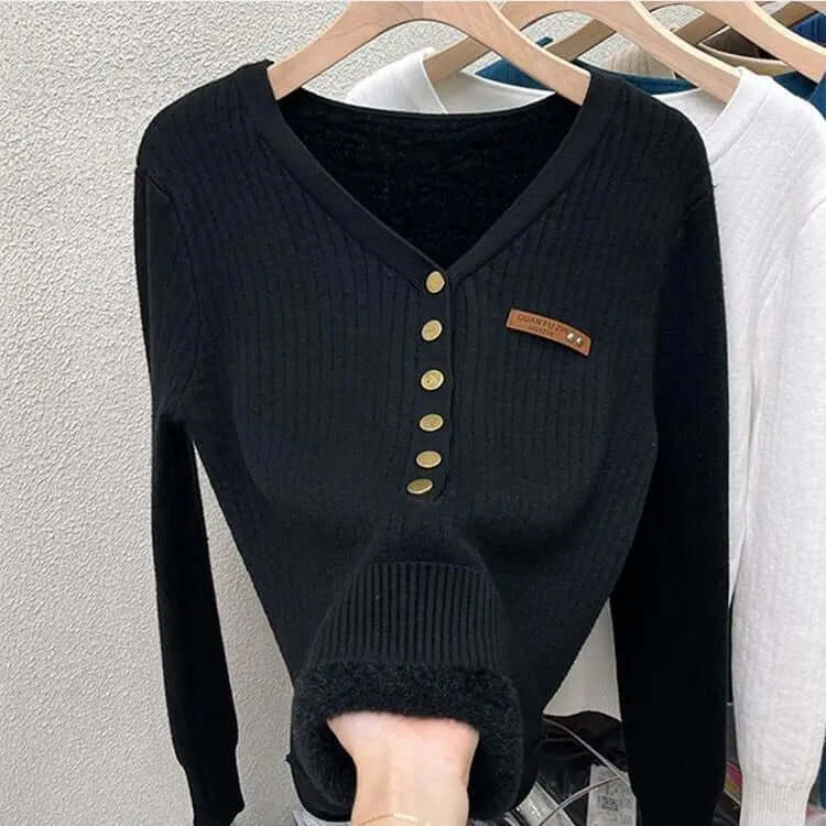 Elegant women's V-neck knitted jumper, a cozy long-sleeve sweater perfect for stylish layering in winterwear.