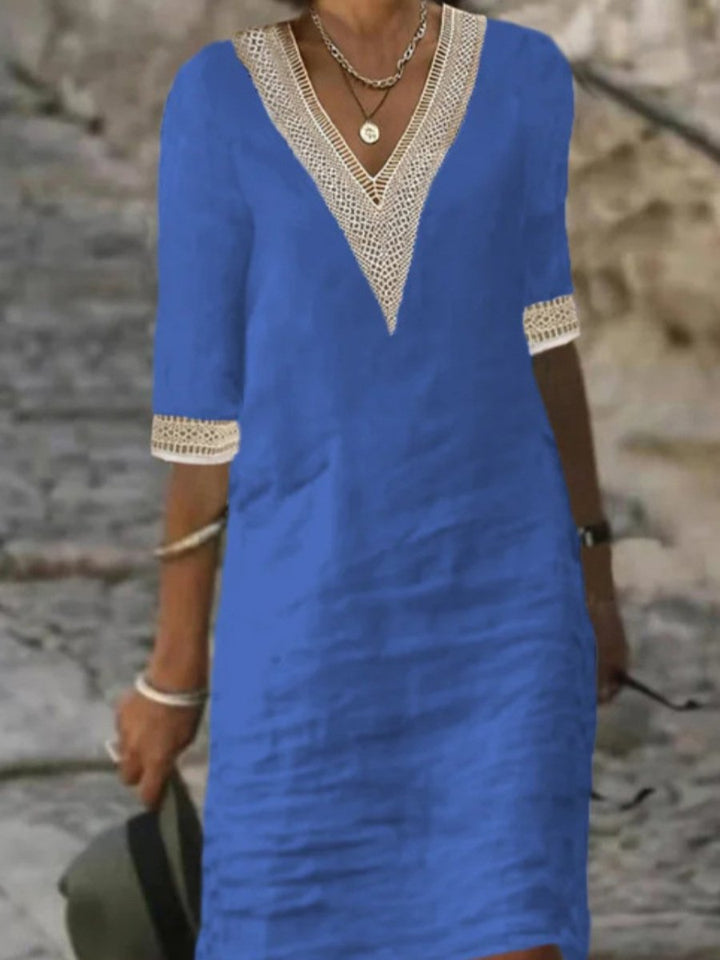 Chic V-neck midi dress with lace trim and 3/4 sleeves, perfect for casual summer or elegant occasions.