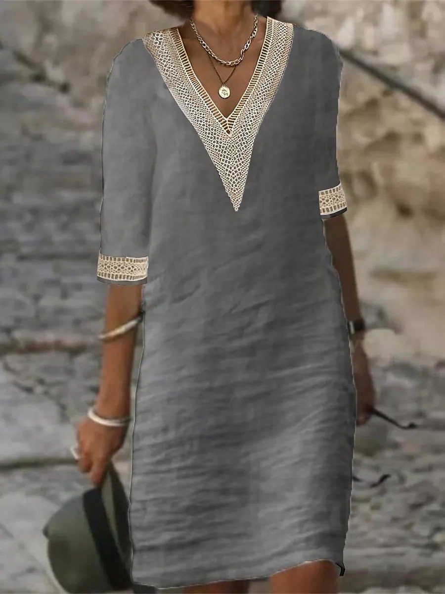 Elegant women's midi dress featuring delicate lace trim, V-neck, and 3/4 sleeves for versatile styling.
