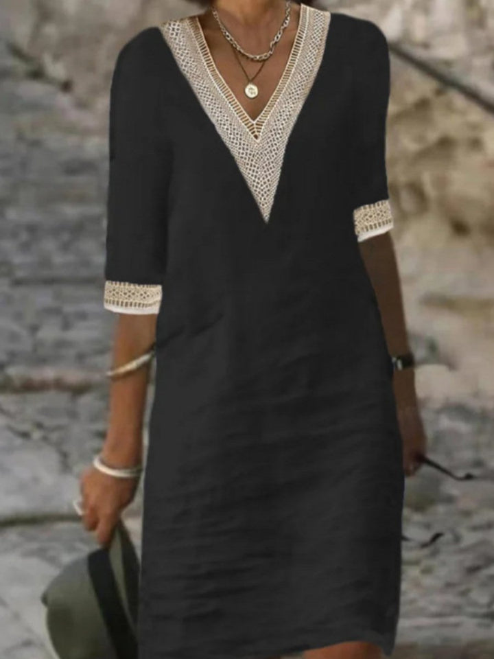 Comfortable women's apparel: V-neck midi dress with flowy design, lace details, and 3/4 length sleeves.