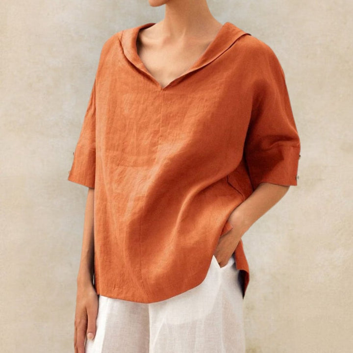 Women's V-neck linen blouse with elbow sleeves and a relaxed fit, perfect for summer casual comfort.