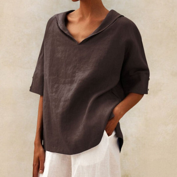 Breathable women's linen V-neck top, relaxed fit, elbow sleeves, ideal for spring & summer elegance.