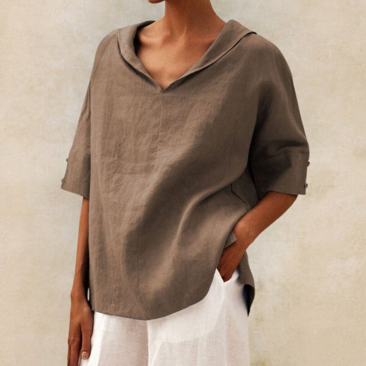 Casual women's v-neck linen shirt, relaxed fit, elbow sleeves, comfortable for warm weather & everyday wear.