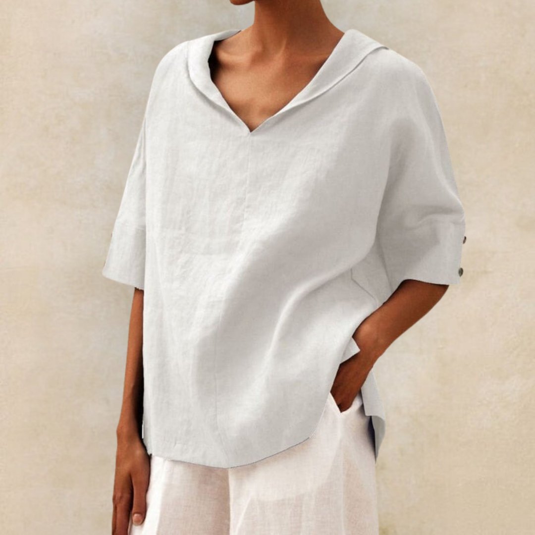Elegant women's elbow sleeve V-neck linen blouse in a relaxed fit for spring and summer fashion.