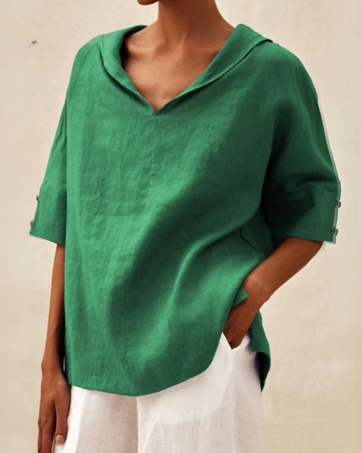Women's V-neck linen blouse with half sleeves, perfect for casual spring/summer fashion.