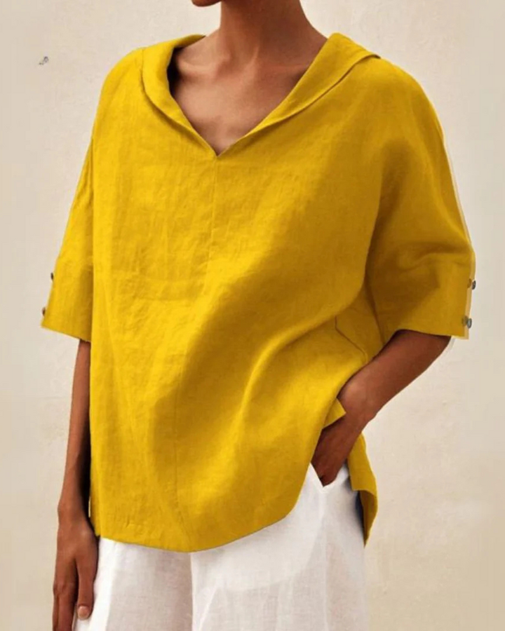 Breathable linen V-neck blouse for women, featuring half sleeves for chic summer comfort.