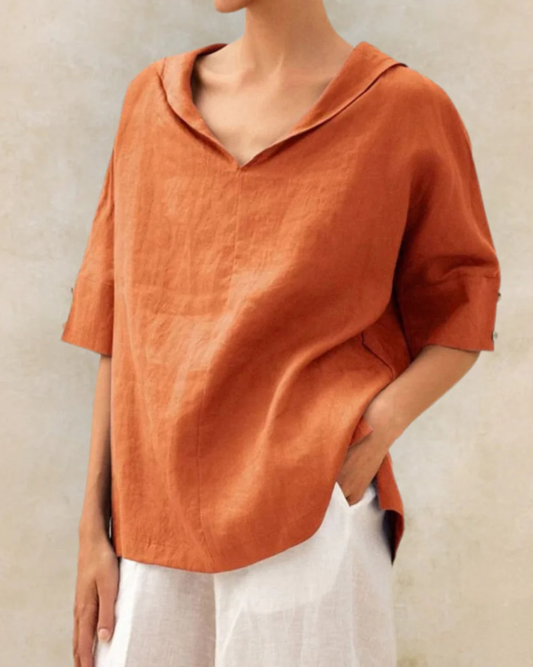 Casual women's linen V-neck top with half sleeves, ideal for breathable spring and summer wear.