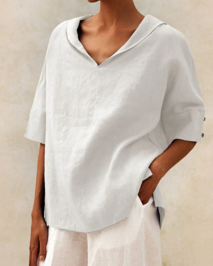 Stylish women's V-neck linen blouse, half-sleeve design perfect for breathable spring and summer casual looks.