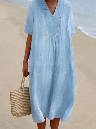 Women's V-Neck Relaxed Midi Dress in soft cotton, perfect for summer. Flowy, sleeveless design for ultimate comfort.