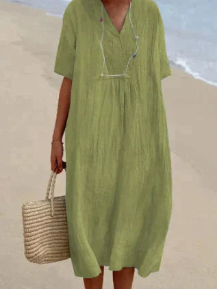 Comfortable women's sleeveless V-neck midi dress. Relaxed fit, breathable cotton, ideal for casual summer fashion.