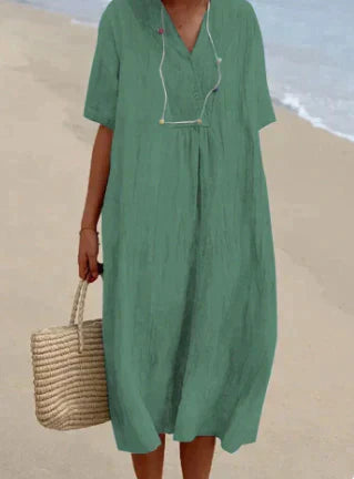 Flowy V-neck midi dress for women. Lightweight, breathable cotton, sleeveless design for effortless summer style.