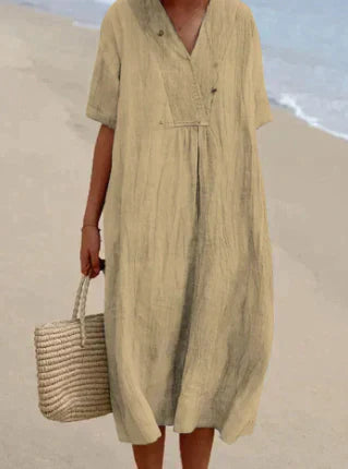 Soft cotton V-neck midi dress for women. Relaxed, sleeveless, and breathable, offering effortless summer comfort.