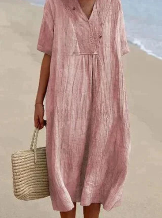 Women's V-neck midi dress. Relaxed fit, sleeveless, and lightweight cotton for breathable, comfortable summer style.
