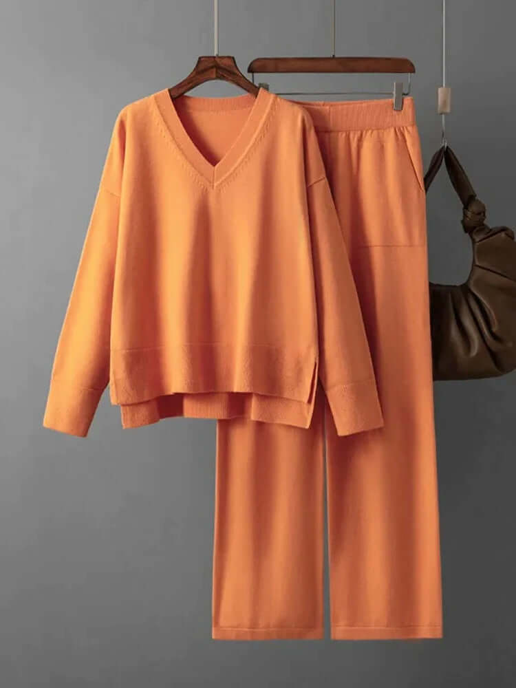 Women's casual fashion set: V-neck sweater and wide-leg trousers. Relaxed and elegant look.