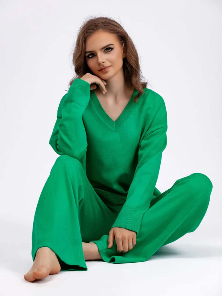Elegant women's two-piece outfit: V-neck sweater & wide-leg trousers. Ideal for a polished look.
