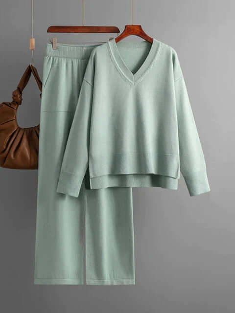 Chic women's loungewear set with a soft v-neck sweater and flowing wide-leg trousers.