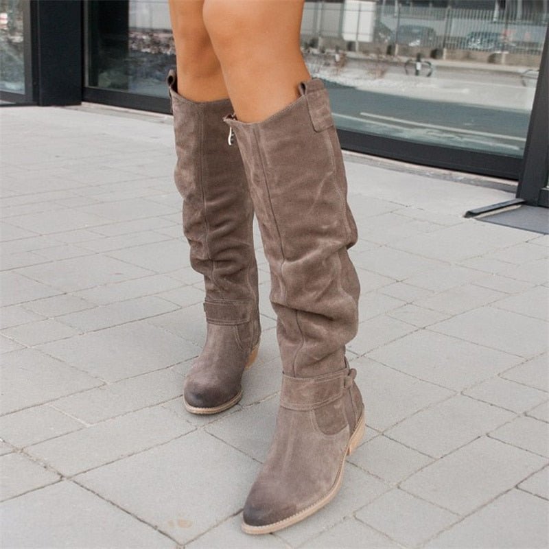 Comfortable women's everyday flat knee-high boots, essential for fall & winter style.