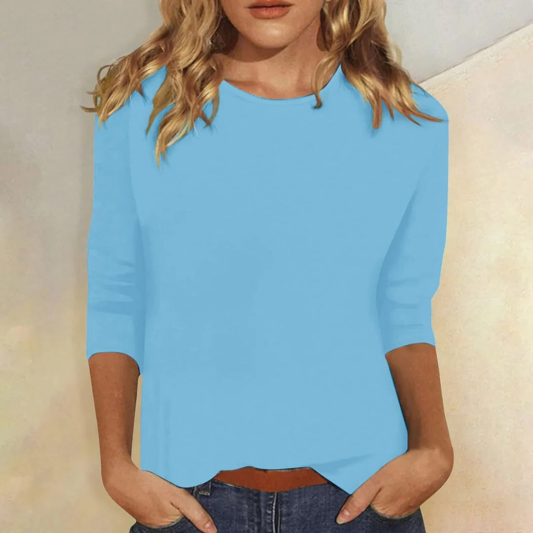 Versatile women's 3/4 sleeve round neck top. Relaxed fit for comfortable everyday casual fashion.