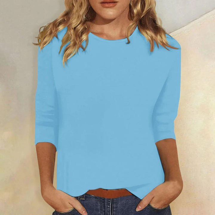 Versatile women's 3/4 sleeve round neck top. Relaxed fit for comfortable everyday casual fashion.