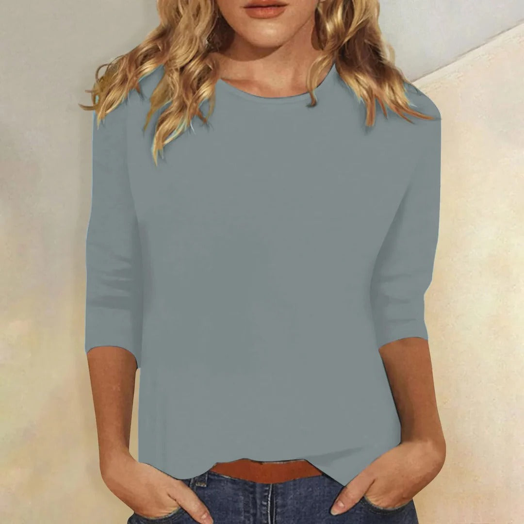 Women's plain round neck 3/4 sleeve casual top. Comfortable & versatile for everyday fashion.