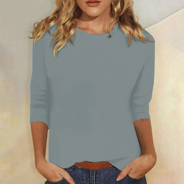 Women's plain round neck 3/4 sleeve casual top. Comfortable & versatile for everyday fashion.