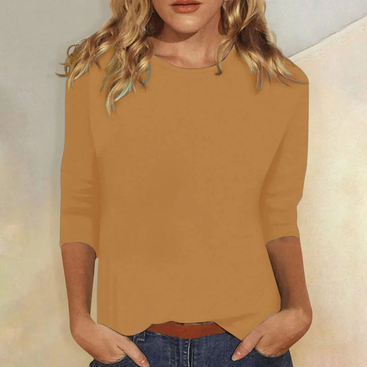 Fashionable women's round neck 3/4 sleeve top. Versatile, plain & relaxed fit for comfortable casual style.