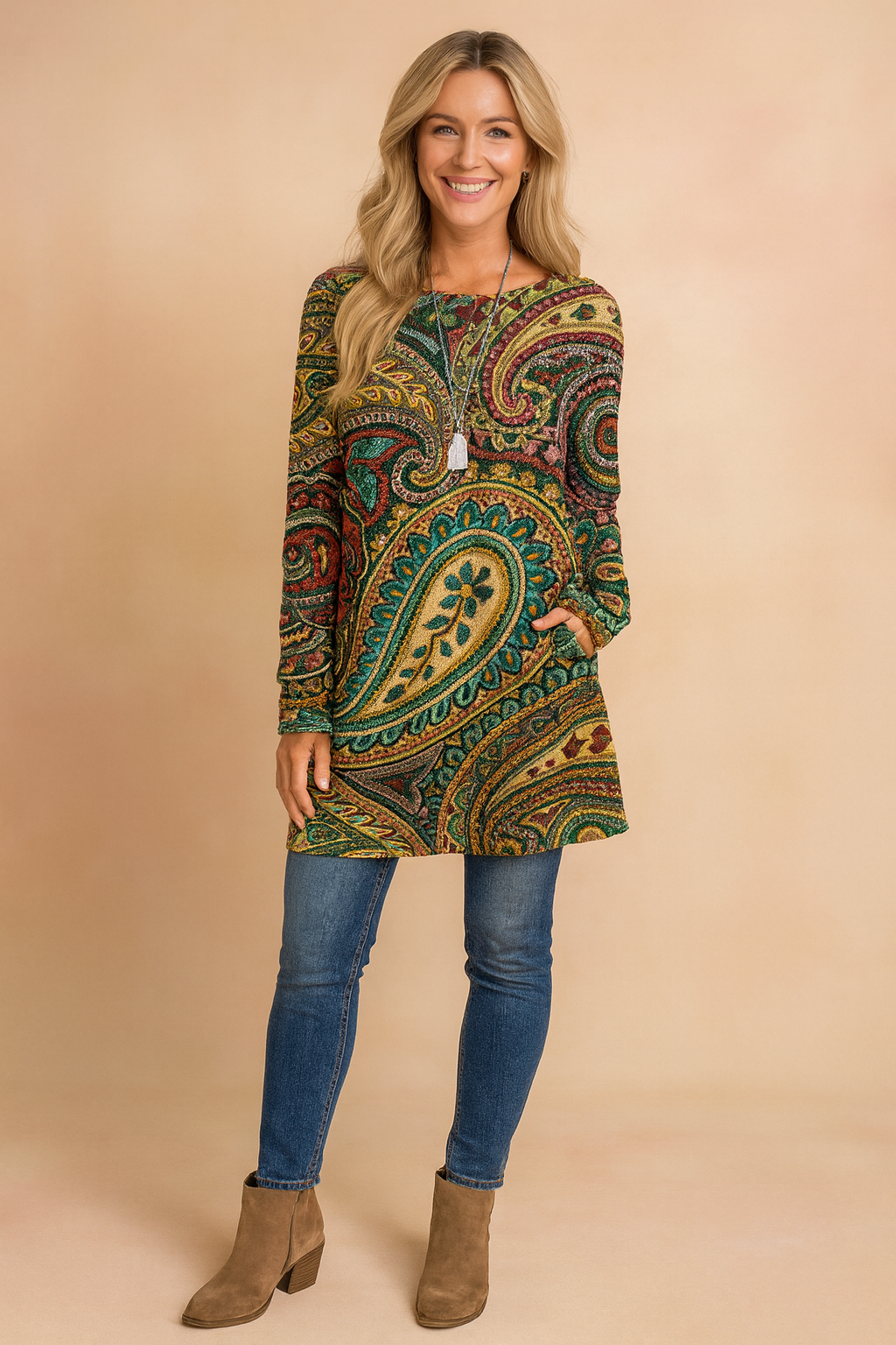 Women's vibrant paisley print tunic sweater, loose fit for casual, fashionable wear. Colorful long-sleeve pullover.
