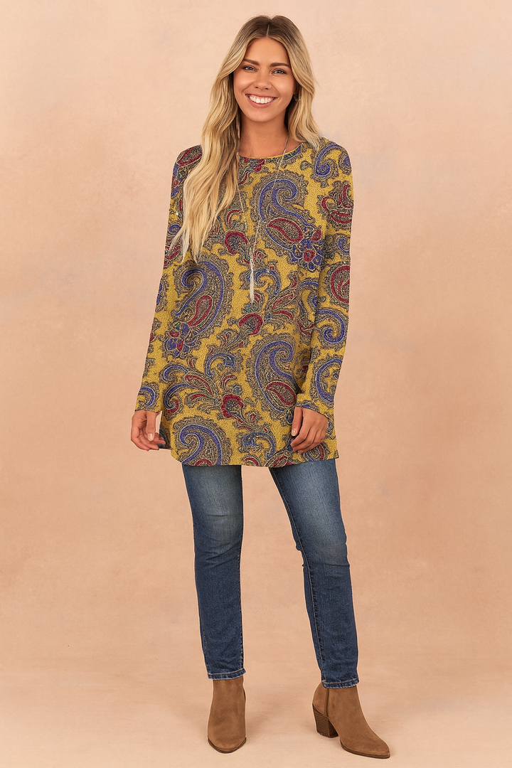 Fashionable women's loose-fit tunic sweater with a vibrant, colorful paisley print. Comfortable long-sleeve casual top.