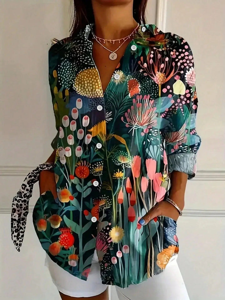 Flowy women's blouse with a playful, vibrant print. Comfortable wear for any season.