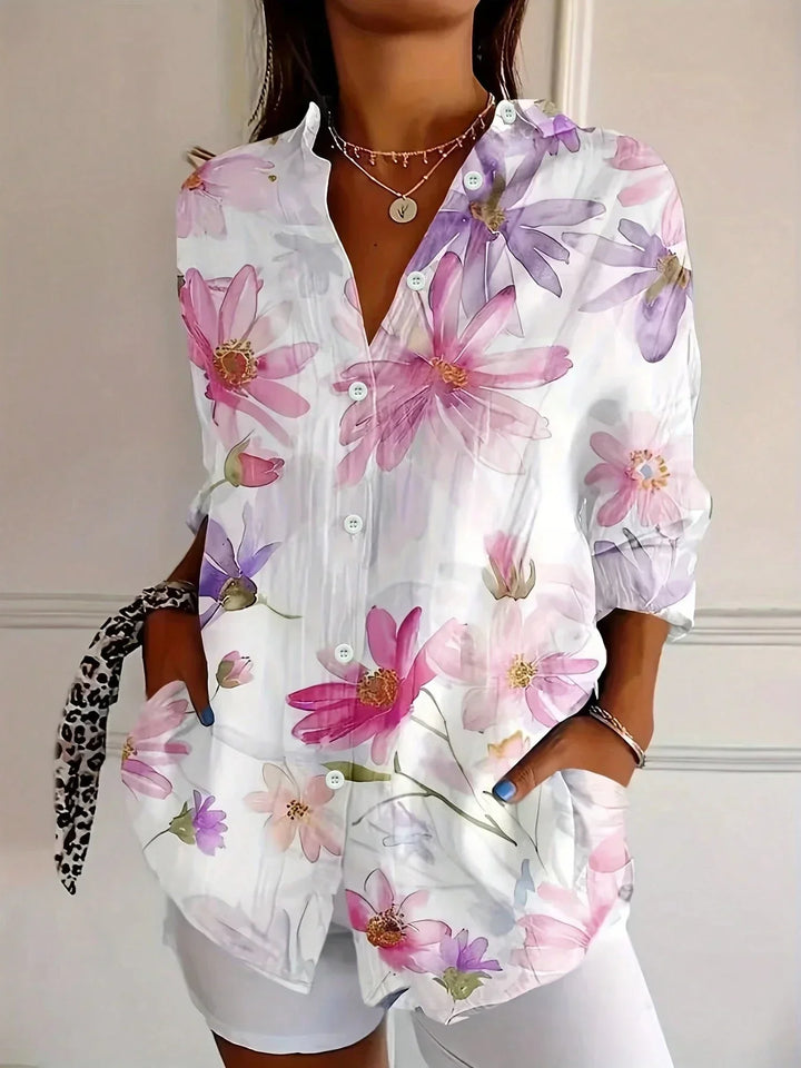 Casual elegant women's blouse, featuring a vibrant colorful print, ideal for summer style.