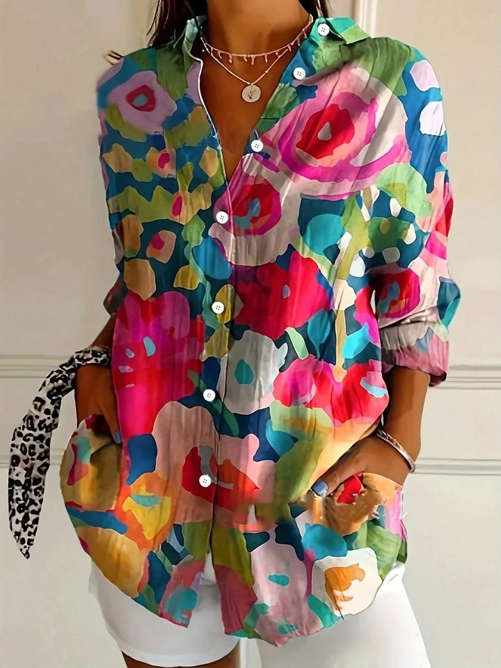Statement top: women's vibrant playful print blouse, perfect for adding color to your outfit.