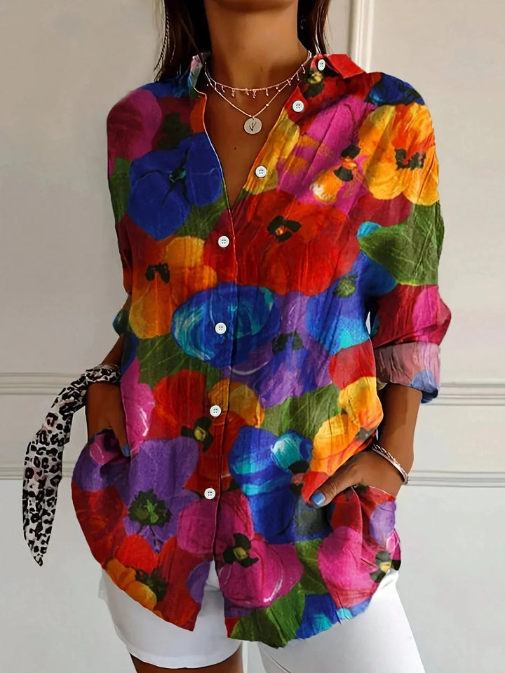 Women's vibrant blouse with a unique playful print, a stylish choice for spring & summer fashion.