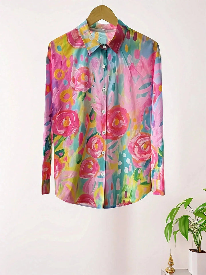 Comfortable women's flowy shirt featuring a lively, colorful print for a vibrant, cheerful style.