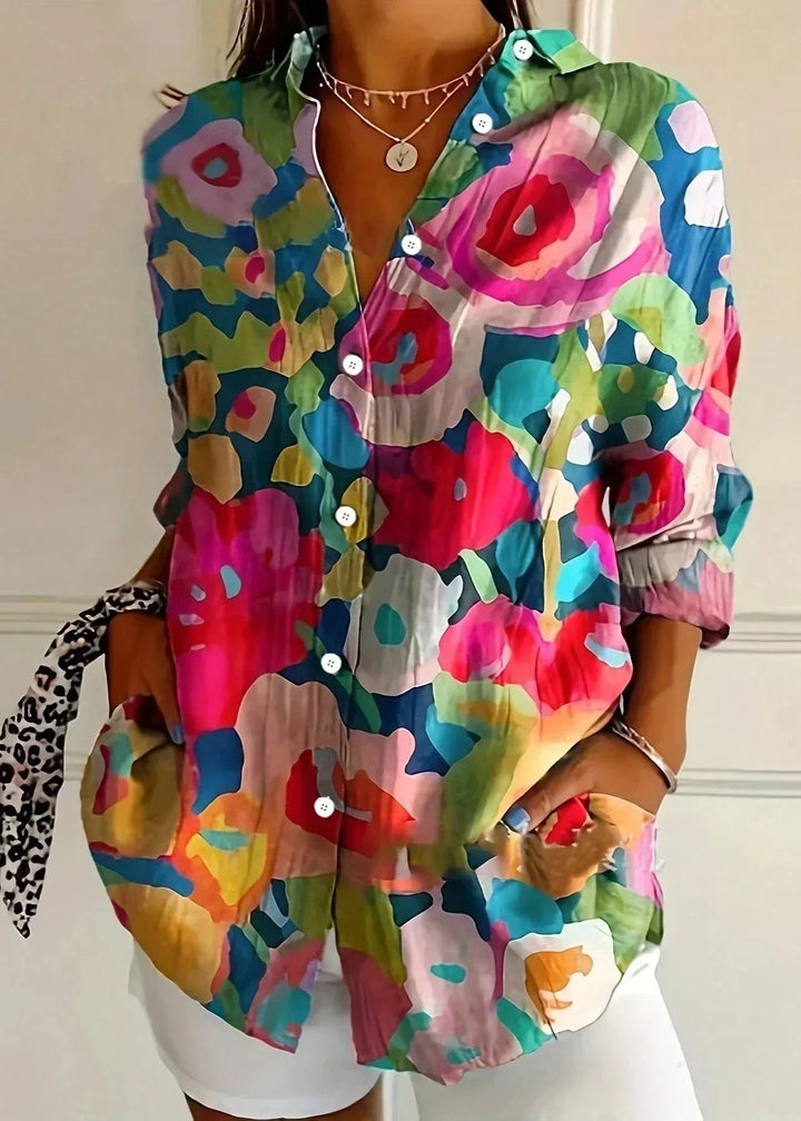 Stylish women's long sleeve printed blouse featuring a vibrant, colorful pattern for chic daily fashion.