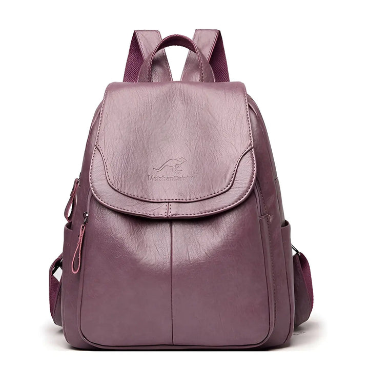 Close-up of stylish women's vintage leather backpack, showing detailed stitching & secure flap closure.