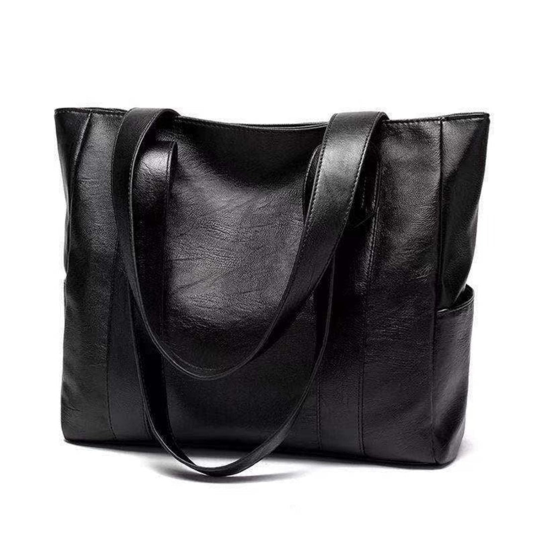 Women's vintage brown leather shoulder bag, an elegant & classic fashion accessory for everyday use.