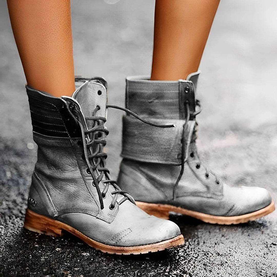 Close-up of women's vintage lace-up combat ankle boots, perfect for casual, edgy autumn & winter outfits.